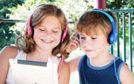 Two kids with headphones on 